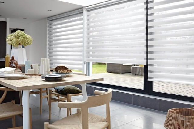 large window shades in a dining area