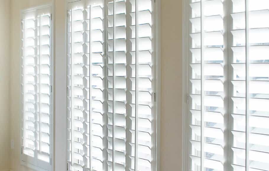Large windows with custom shutters installed